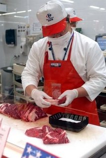 AFP/File – A staff is seen packaging imported US beef for sale at a Taipei supermarket. 